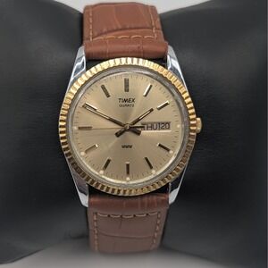 Timex Quartz Day Date Gold Tone Fluted Bezel Champagne Dial Brown Strap 34mm